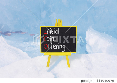 ICO initial coin offering symbol. Concept words ICO initial coin offering on beautiful yellow blackboard. Beautiful blue ice background. Business ICO initial coin offering concept. Copy space. ICO initial coin offering symbol. Concept words ICO initial coin offering on beautiful yellow blackboard. Beautiful blue ice background. Business ICO initial coin offering concept. Copy space. 114940976