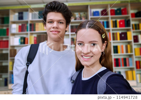 Selfie portrait of friends teenagers high school students looking at camera inside classroom Selfie portrait of friends teenagers high school students looking at camera inside classroom 114941728