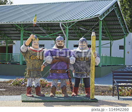 sculptures of ancient Russian heroes on the playground. warrior, knight. beard, mustache and protective helmet. characters from Russian fairy tales and epics sculptures of ancient Russian heroes on the playground. warrior, knight. beard, mustache and protective helmet. characters from Russian fairy tales and epics 114942260