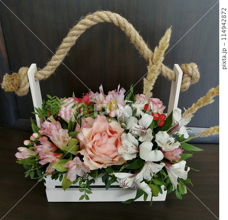 Flowers cute bouquet with roses and alstroemerias pink white green, wooden box 114942872