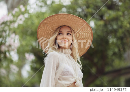 High Fashion Blonde Luxury Woman in Sensual Spring Outfit in the Park High Fashion Blonde Luxury Woman in Sensual Spring Outfit in the Park 114949375