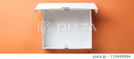 Empty white cardboard box on orange backdrop 114949994