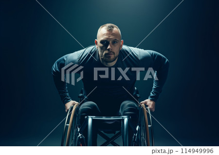 Athletic man in a wheelchair with intense look 114949996