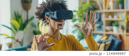 Young person with VR headset in a home setting 114949997