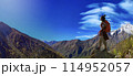 hiker standing and watching view 114952057