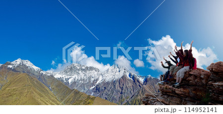 Group of happy hiker raised up arms on the hill 114952141