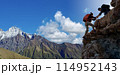 Asian hiking help each other on mountains 114952143