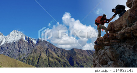 Asian hiking help each other on mountains 114952143