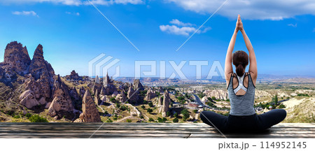 Young woman practicing yoga in the nature 114952145