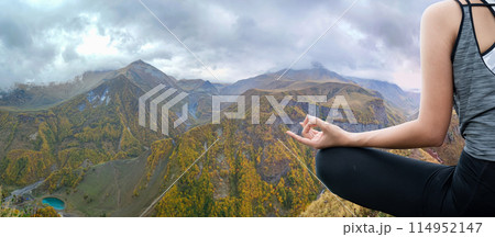 Young woman practicing yoga in the nature 114952147