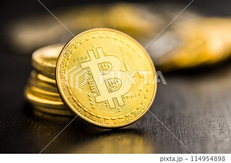 Bitcoin gold coin on black table. 114954898