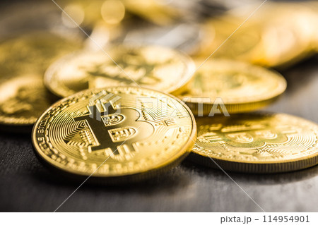 Bitcoin gold coin on black table. 114954901