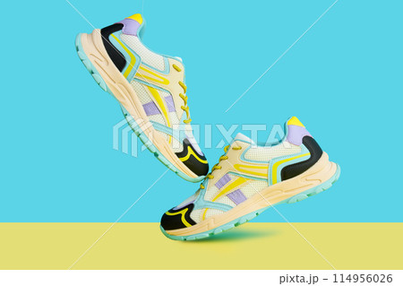 Fashionable Sneakers on colorful background. Creative banner with stylish shoes Fashionable Sneakers on colorful background. Creative banner with stylish shoes 114956026