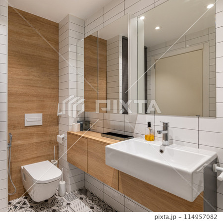 Modern bathroom with wooden accents and white tiles for a clean and stylish look Modern bathroom with wooden accents and white tiles for a clean and stylish look 114957082