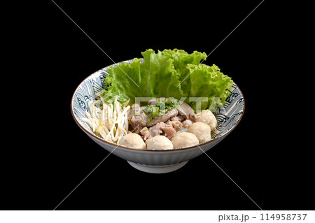 Thai noodles soup with boiled pork offal and vegetables serve in bowl on black background. Asian food concept Thai noodles soup with boiled pork offal and vegetables serve in bowl on black background. Asian food concept 114958737