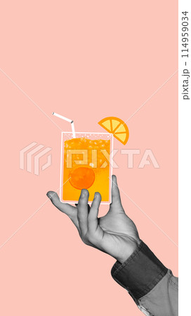 Monochrome hand holding colorful citrus cocktail with oranges. cool lemonade against light peach background. Creative colorful design. 114959034