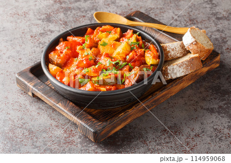 Summer Vegetable spicy stew of zucchini, potatoes, peppers, onions, tomatoes and eggplant close-up in a bowl. Horizontal 114959068