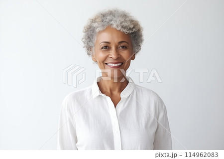 Portrait of beautiful happy smiling african mature woman with gray hair on white studio background 114962083