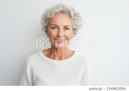 Portrait of beautiful happy smiling mature woman on white studio background 114962084