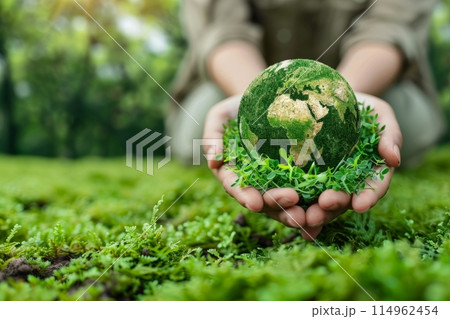 Childs Hands Embrace Green Earth Globe in Lush...のイラスト素材 [114962454 ...