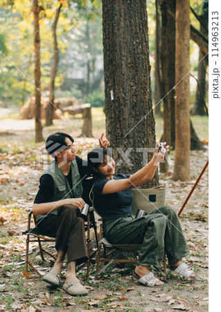 Asian couple sweet in tent inside on they camping trip, traveller relax and sleep togather in out door and camping trip Asian couple sweet in tent inside on they camping trip, traveller relax and sleep togather in out door and camping trip 114963213