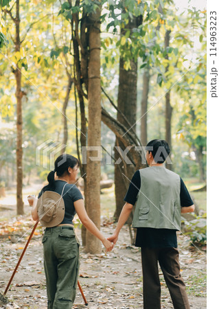 Asian couple sweet in tent inside on they camping trip, traveller relax and sleep togather in out door and camping trip 114963223