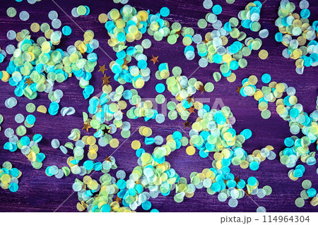 Festive background with confetti. Carnival greeting card with golden stars Festive background with confetti. Carnival greeting card with golden stars 114964304