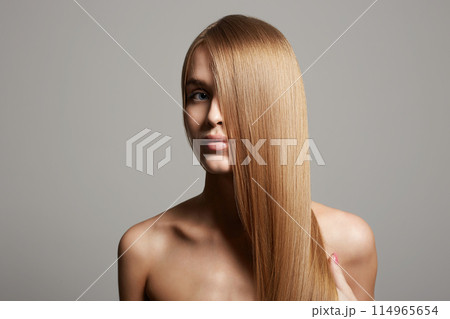 beautiful blond hair young woman. girl with smooth wheat colored hair beautiful blond hair young woman. girl with smooth wheat colored hair 114965654