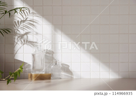 A simple interior background with warm sunlight streaming in through the window. 114966935