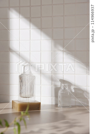 A simple interior background with warm sunlight streaming in through the window. 114966937