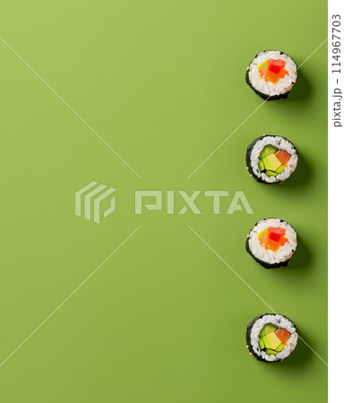 Set of sushi rolls top view over soft green background Set of sushi rolls top view over soft green background 114967703