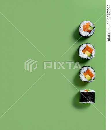 Set of sushi rolls top view over soft green background Set of sushi rolls top view over soft green background 114967706