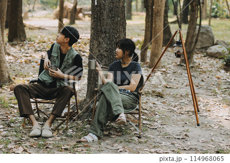 Asian couple sweet in tent inside on they camping trip, traveller relax and sleep togather in out door and camping trip 114968065