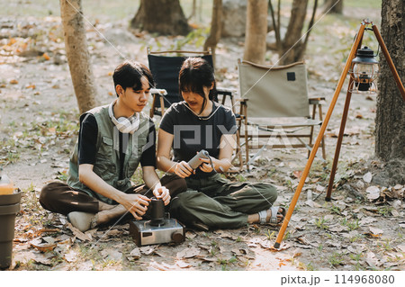 Asian couple sweet in tent inside on they camping trip, traveller relax and sleep togather in out door and camping trip 114968080