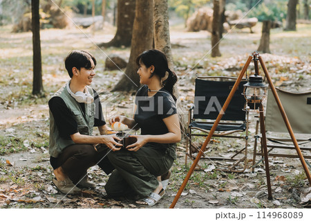 Asian couple sweet in tent inside on they camping trip, traveller relax and sleep togather in out door and camping trip Asian couple sweet in tent inside on they camping trip, traveller relax and sleep togather in out door and camping trip 114968089