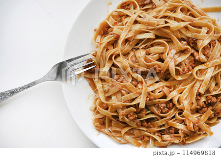 Pasta with meat on a plate. Delicious noodles with meat. Italian cuisine. Pasta with meat on a plate. Delicious noodles with meat. Italian cuisine. 114969818