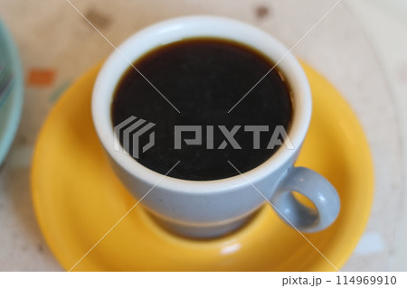 cup of coffee or tea and dessert in coffee shop or restaurant. Drink fragrant black drink during break. 114969910