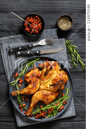 butterflied, spatchcock roast chicken on a plate 114970546