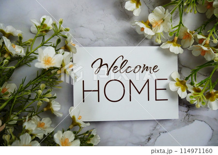 Welcome Home card with flower bouquet decoration top view on marble background 114971160