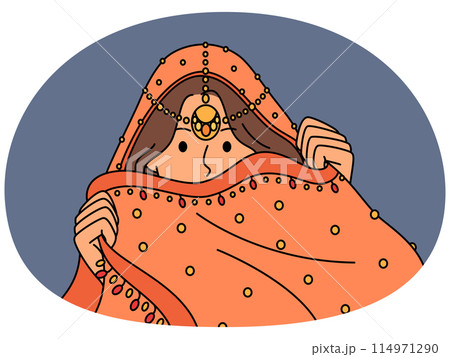 Indian woman hides face behind national dress during traditional cultural ritual or ethnic wedding Indian woman hides face behind national dress during traditional cultural ritual or ethnic wedding 114971290