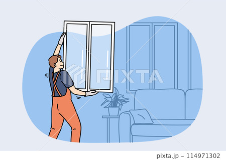 Man master changing window in apartment, holding casement in hands standing near sofa 114971302