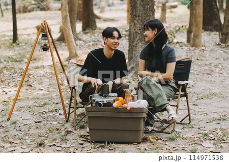 Asian couple sweet in tent inside on they camping trip, traveller relax and sleep togather in out door and camping trip 114971538