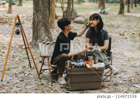 Asian couple sweet in tent inside on they camping trip, traveller relax and sleep togather in out door and camping trip 114971539