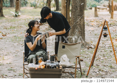 Asian couple sweet in tent inside on they camping trip, traveller relax and sleep togather in out door and camping trip Asian couple sweet in tent inside on they camping trip, traveller relax and sleep togather in out door and camping trip 114971544