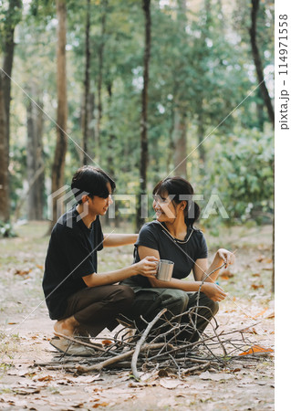 Asian couple sweet in tent inside on they camping trip, traveller relax and sleep togather in out door and camping trip Asian couple sweet in tent inside on they camping trip, traveller relax and sleep togather in out door and camping trip 114971558