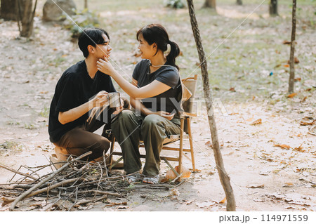 Asian couple sweet in tent inside on they camping trip, traveller relax and sleep togather in out door and camping trip Asian couple sweet in tent inside on they camping trip, traveller relax and sleep togather in out door and camping trip 114971559