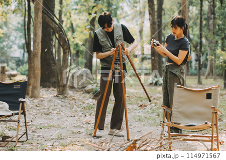 Asian couple sweet in tent inside on they camping trip, traveller relax and sleep togather in out door and camping trip Asian couple sweet in tent inside on they camping trip, traveller relax and sleep togather in out door and camping trip 114971567