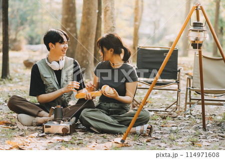 Asian couple sweet in tent inside on they camping trip, traveller relax and sleep togather in out door and camping trip 114971608