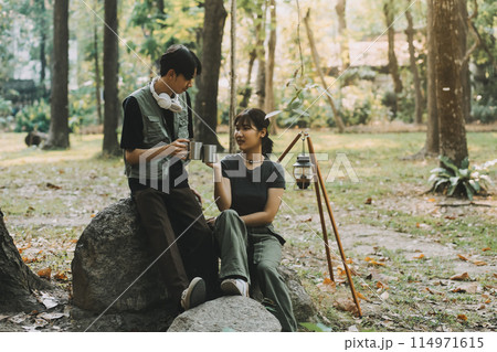 Asian couple sweet in tent inside on they camping trip, traveller relax and sleep togather in out door and camping trip 114971615