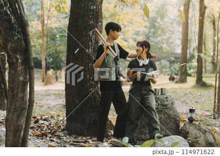 Asian couple sweet in tent inside on they camping trip, traveller relax and sleep togather in out door and camping trip 114971622